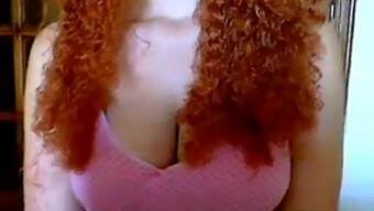 Busty Redhead With Curly Hair Shows Off On Web Cam