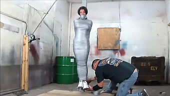 Curvy Woman Restrained With Duct Tape For Erotic Bondage Play