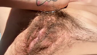 Hairy Amateur Sunbathing Outdoors With A Big Clitoris