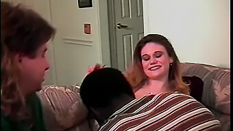 A Young Brunette Girl Gives Oral Pleasure To A Man While A Black Man Penetrates Her Vigorously.